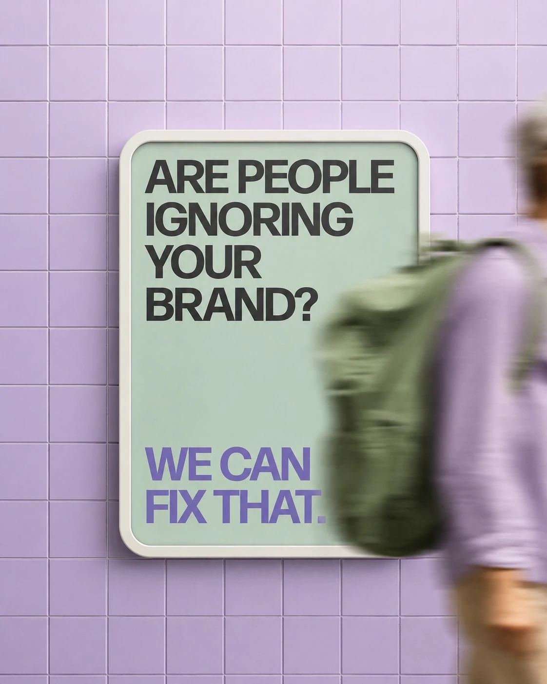A poster ad on a tiled wall reading, are people ignoring your brand